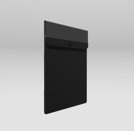 Black laptop sleeve with a brand logo on a light gray background